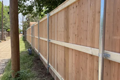 Galvanized steel posts and rails on a cedar fence built by Hudson Fence Company in Lubbock, TX