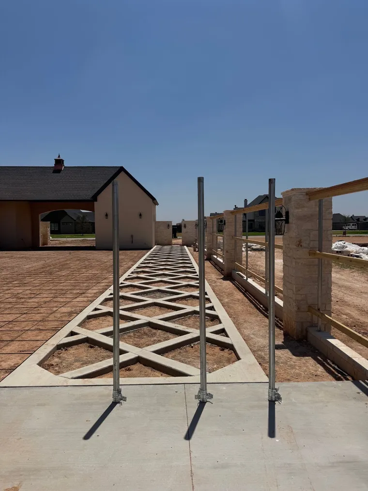 Custom diamond-pattern concrete walkway at a new home in the Lubbock area
