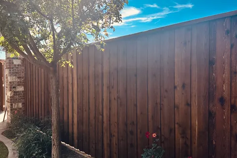 Cedar fence and gate maintained by Hudson Fence Company in Lubbock, TX